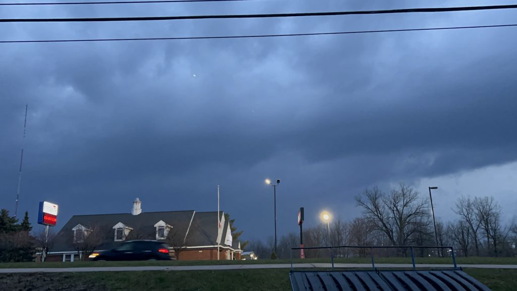 Dark storm clouds over a business.